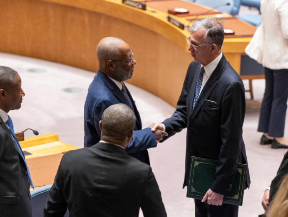 Sérgio França Danese (centre left), Permanent Representative of Brazil to the United Nations and President of the Security Council for the month of October, greets Jean Victor Geneus, Minister for Foreign Affairs of Haiti, after the Security Council meeting on the question concerning Haiti.