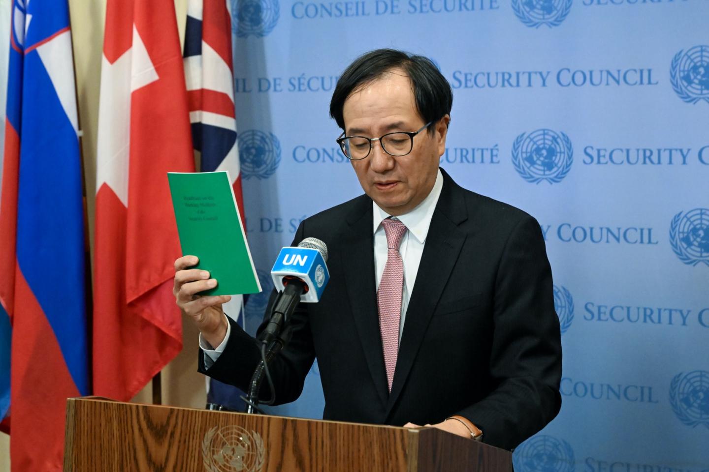Man speaking at a podium.